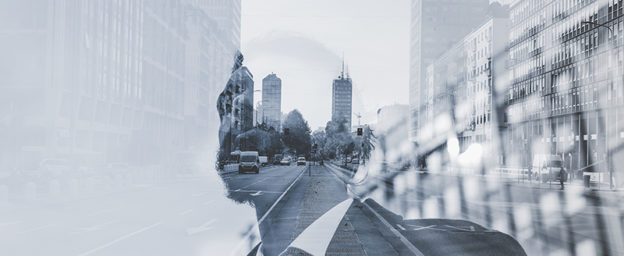 Multiple exposure of business man and city